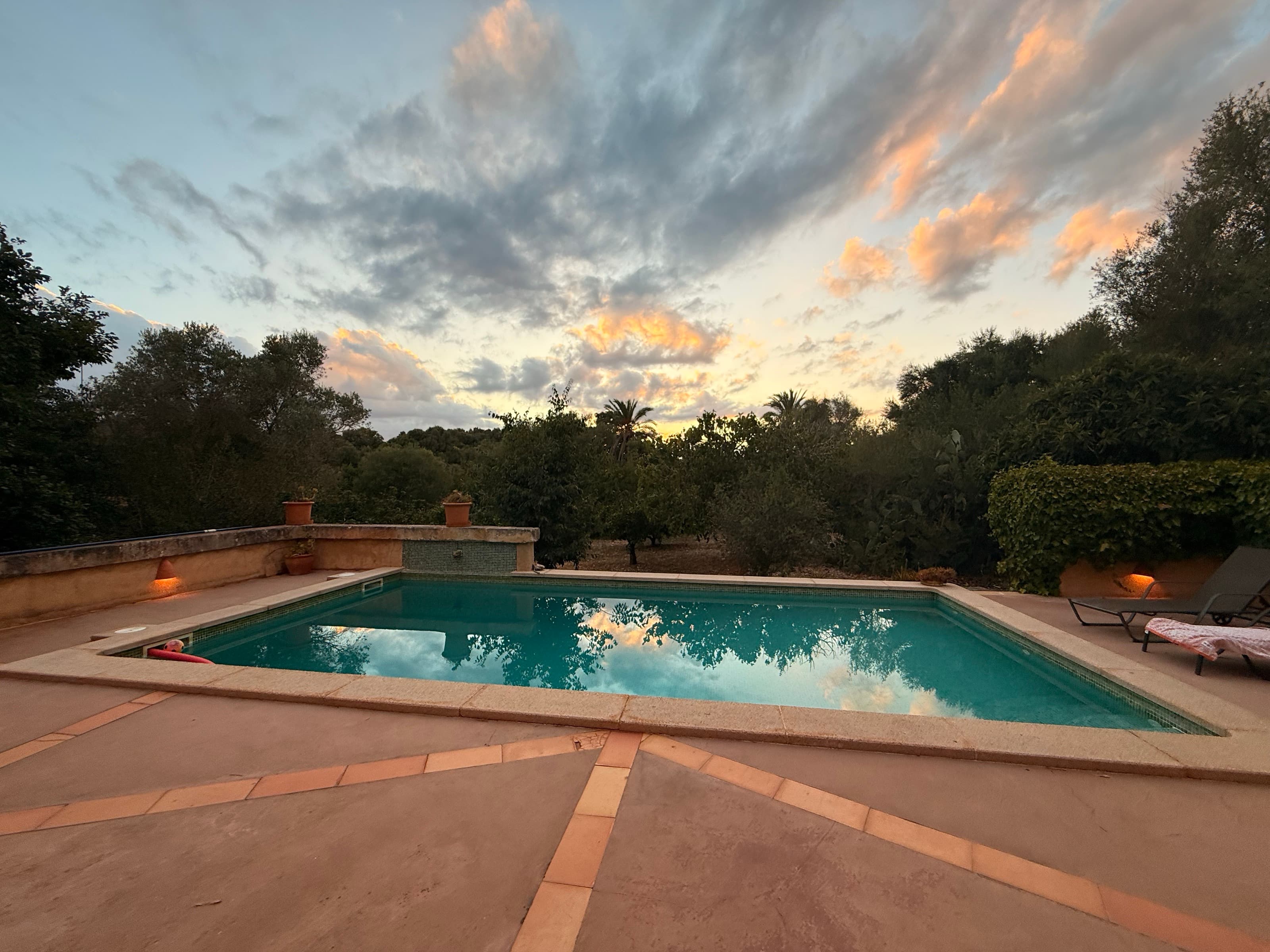 The Villa, Dusk — pool · pines