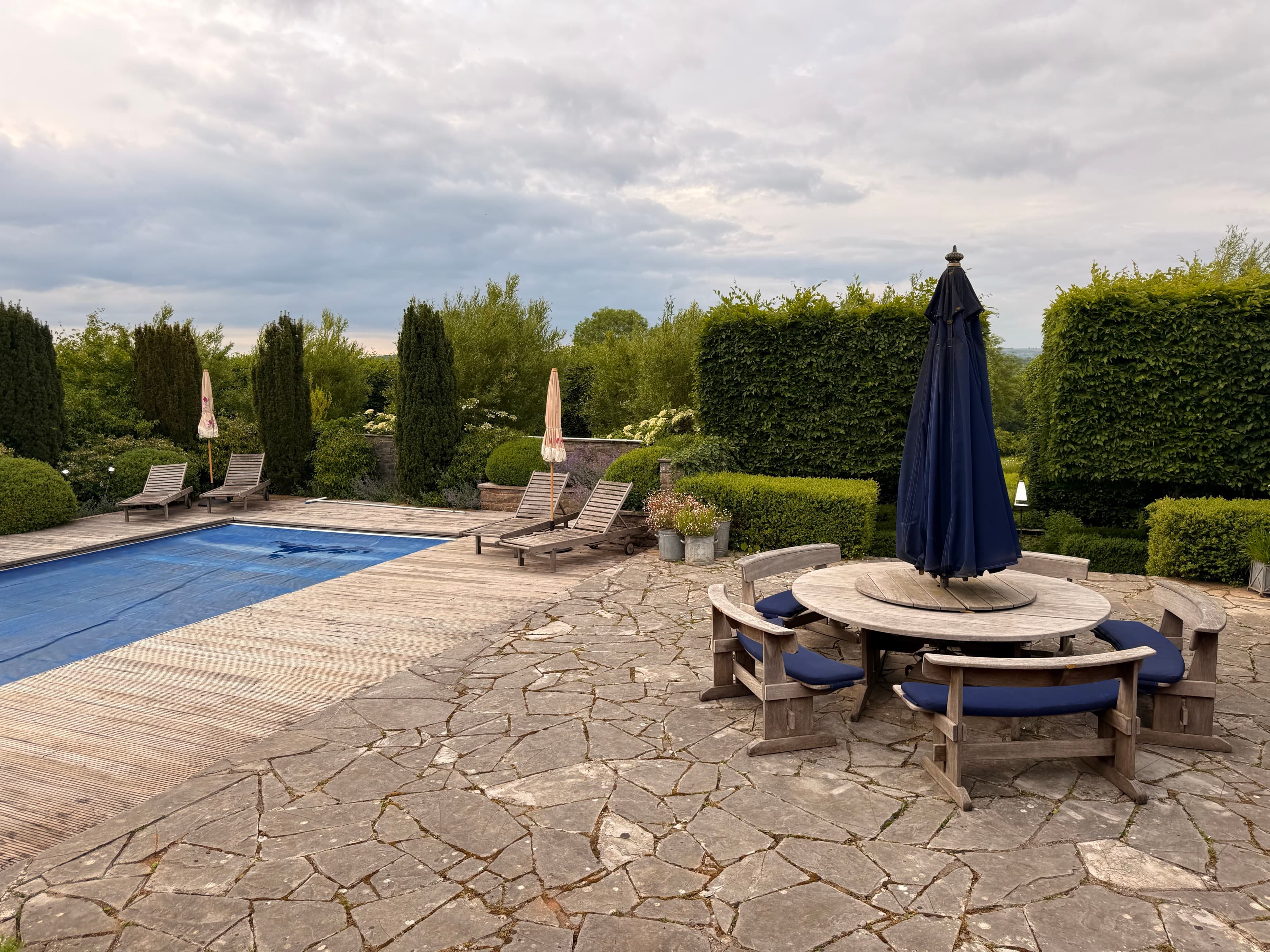The Pool Terrace — stone · parasol
